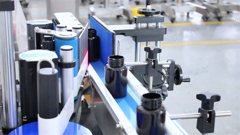 VK-TL etiķetes velmēšanas mehānisms