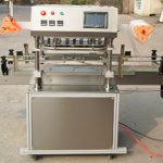 Automātiska trīs galvu uzkodu burciņu plēves aizzīmogošanas mašīna